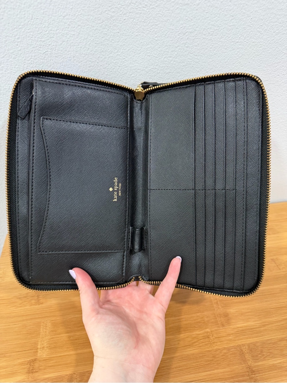kate spade black zip-around continental wallet with gold plaque